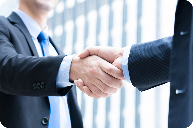 Business handshake representing payroll provider partnership